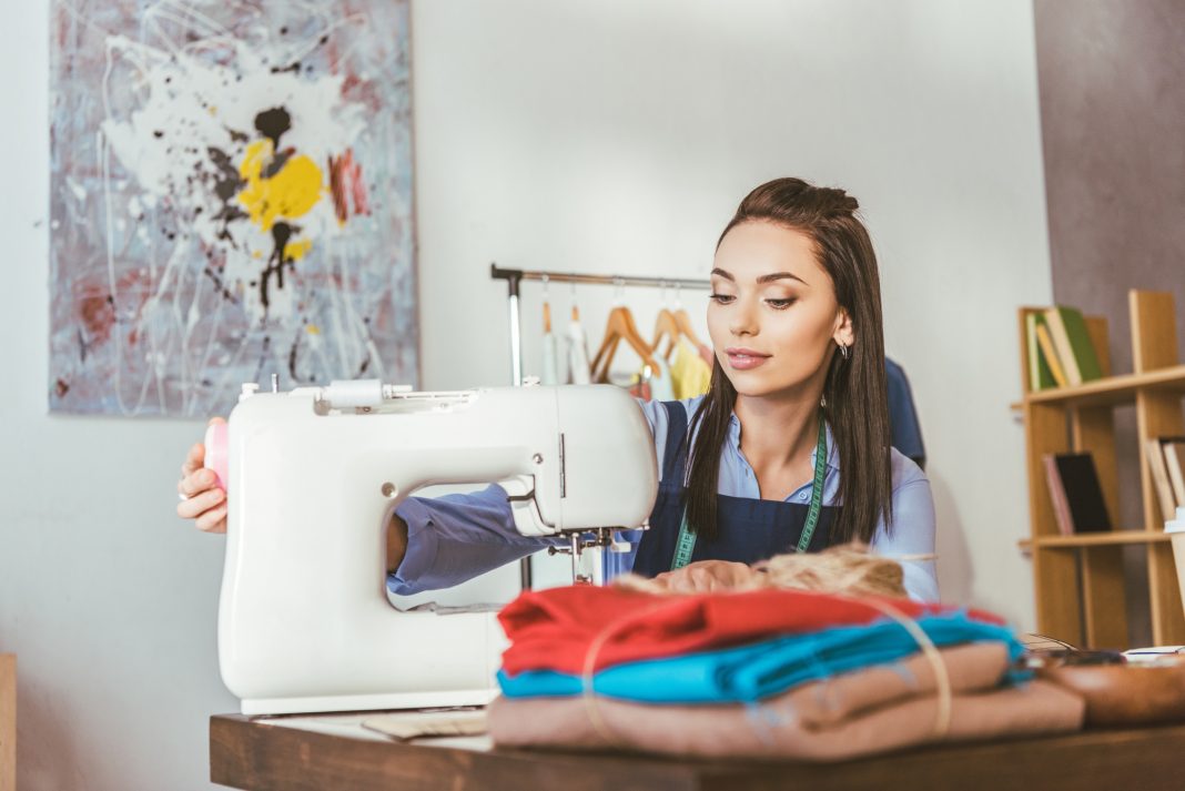 woman learning to sew on her machine